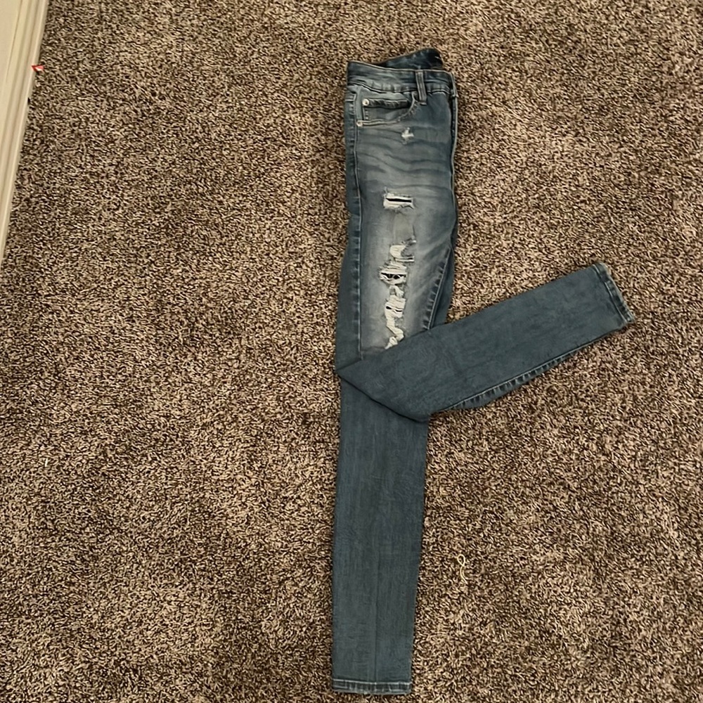 Light washed ripped blue jeans